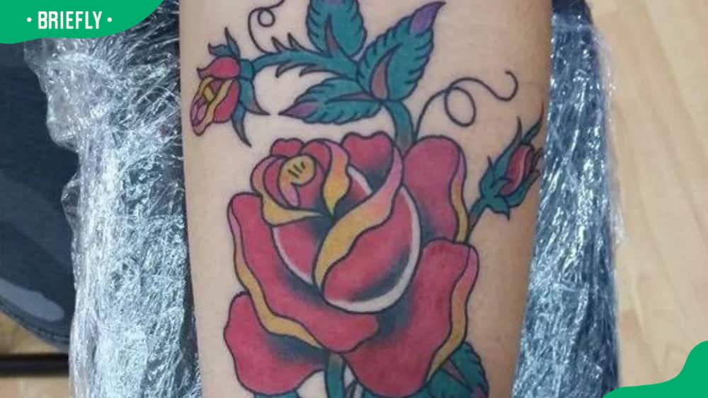 Rose and tendrils tattoo