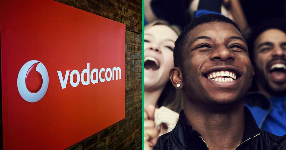 The Vodacom sign, and a group of happy people celebrating
