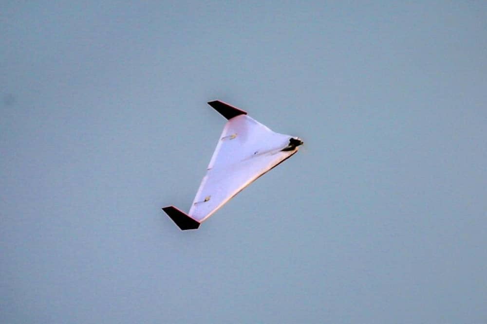 An Iranian unmanned aerial vehicle (UAV) or drone flies during Iranian military exercises in 2020 near sensitive Gulf waters in the Strait of Hormuz