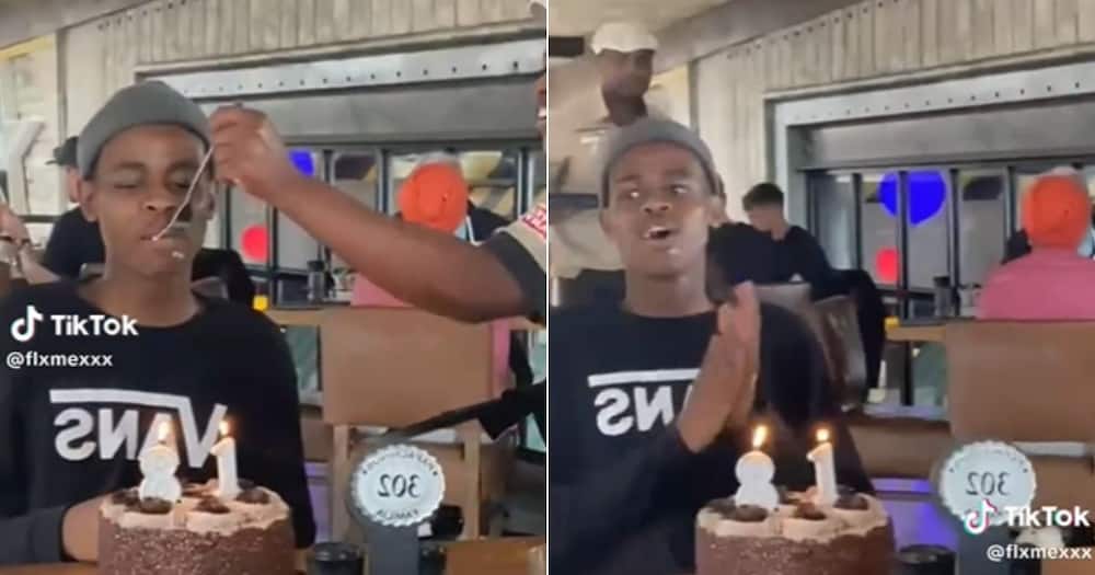 Waitress smother young man's face with cake