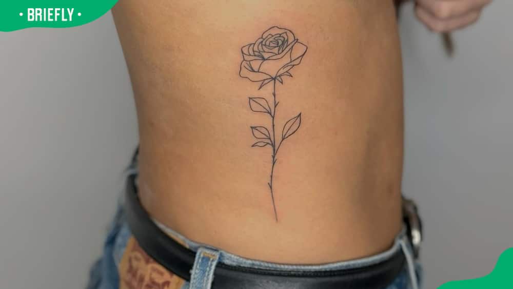 Rose tattoo on ribs
