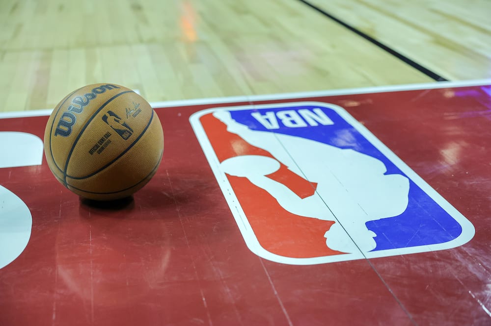 Basketball next to an NBA logo