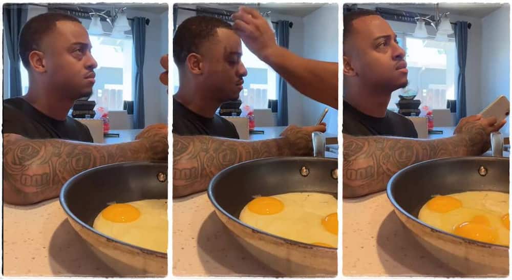 A woman breaks an egg on her husband's head