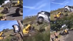 Angry farmer lifts & drops car with tractor after man blocks his gate