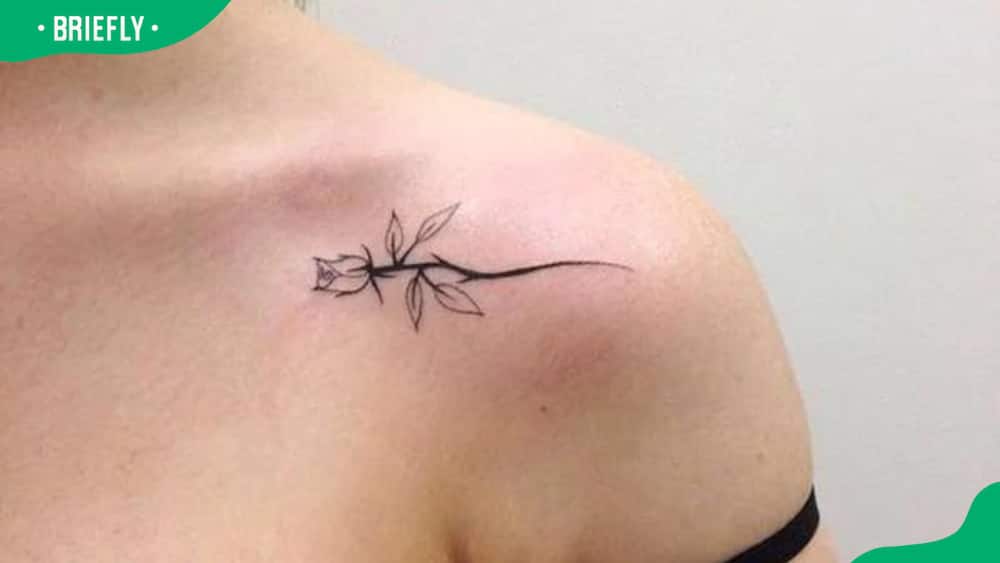 Delicate shoulder rose tattoo