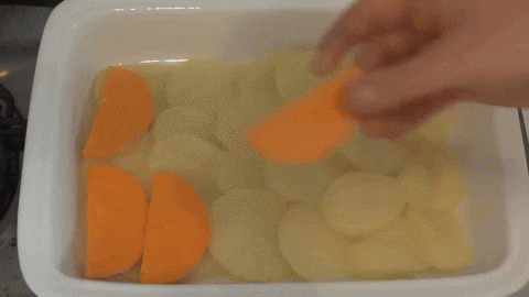 Preparing potato and vegetables bake
