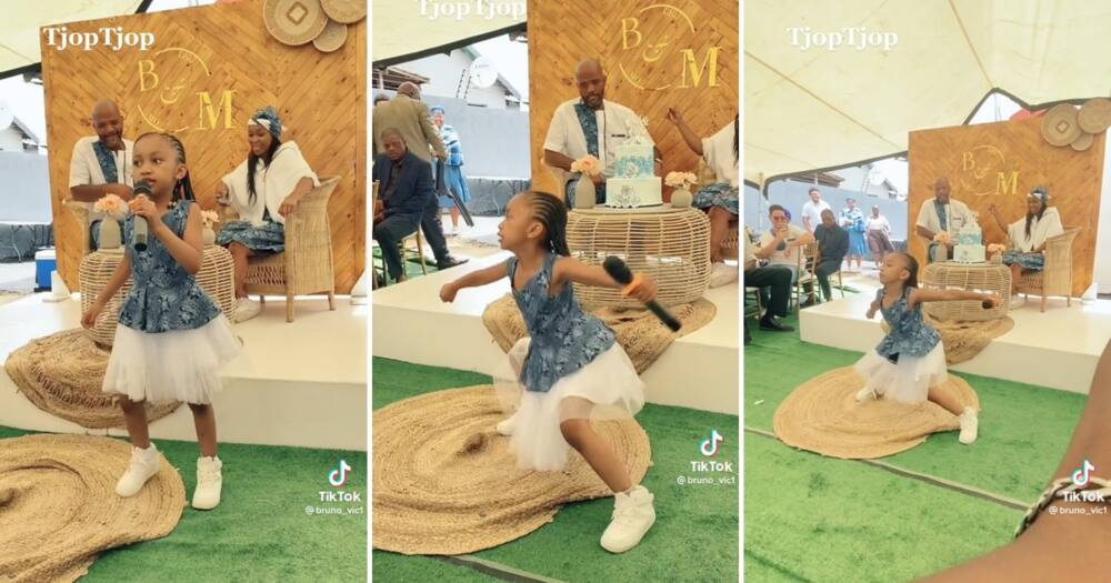 Little girl entertains wedding guests with a lit dance