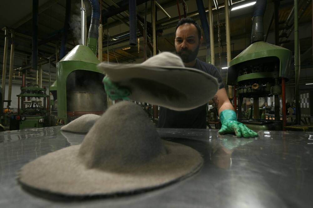 Artisans mould and shape the Fedoras, using quick gestures with surgical precision Artisans mould and shape the Fedoras, using quick gestures with surgical precision