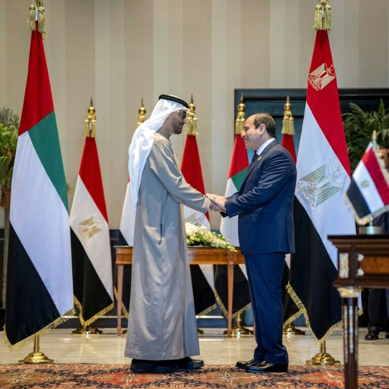 UAE President Sheikh Mohamed bin Zayed al-Nahyan, on the left, and Egypt's President Abdel Fattah el-Sisi shake hands after a ceremony to sign a memorandum of understanding to build a 10-gigawatt onshore wind project in Egypt