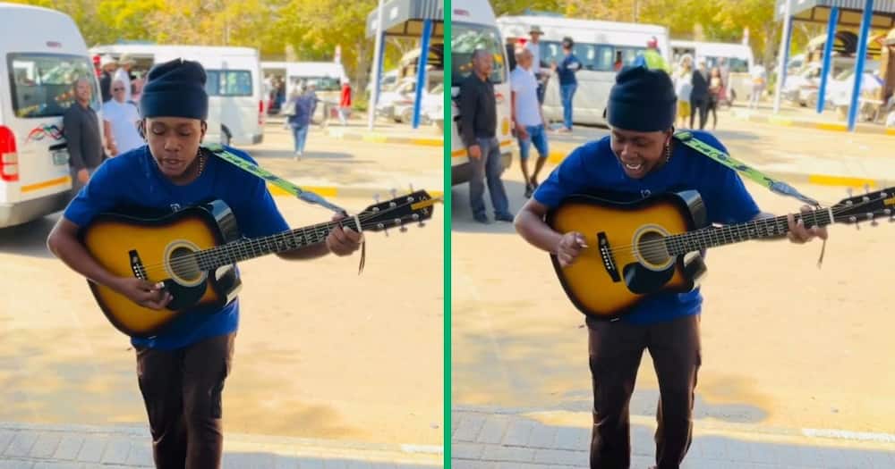 A man played his guitar and sang at the taxi rank