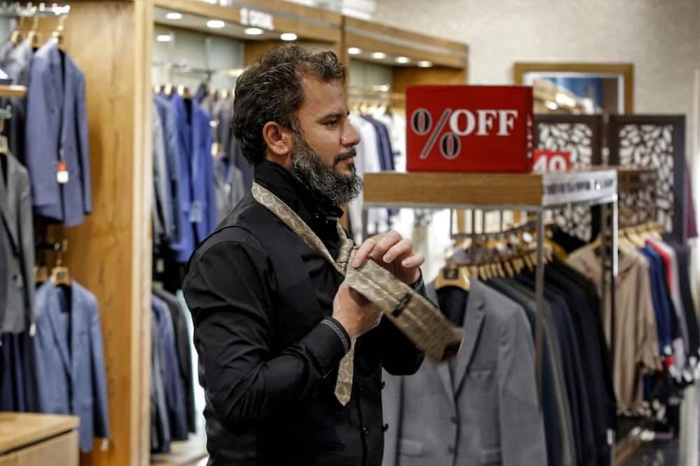 The necktie is making a timid return to upmarket clothing stores in well-to-do north Tehran
