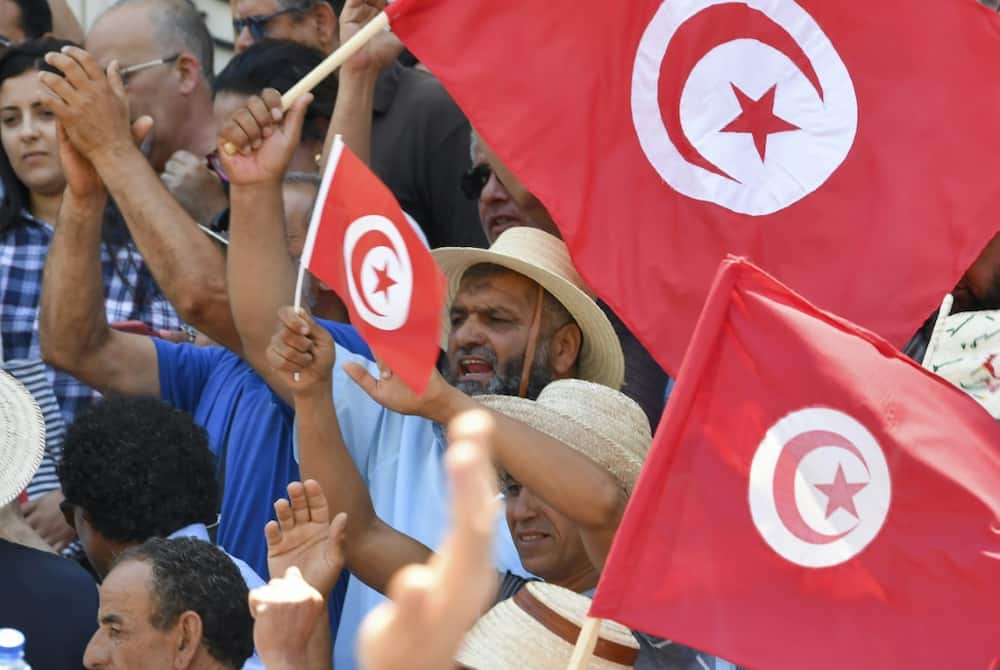 Tunisians in the capital Tunis protest on June 19, 2022 against President Kais Saied and the constitutional referendum to be held on July 25