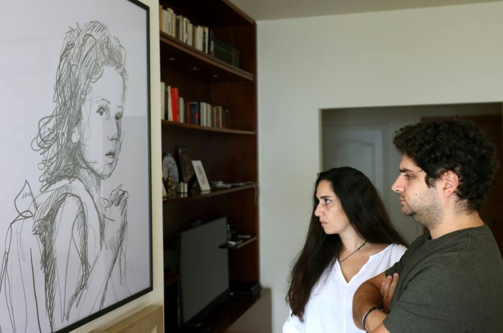 Bereaved parents Paul and Tracy Naggear look at a drawing of their late daughter Alexandra, who was killed in the Beirut port blast of August 2020