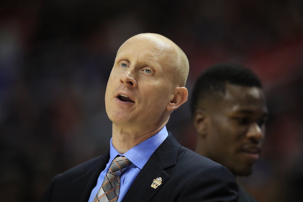 Chris Mack reacts during a game against the Gonzaga Bulldogs
