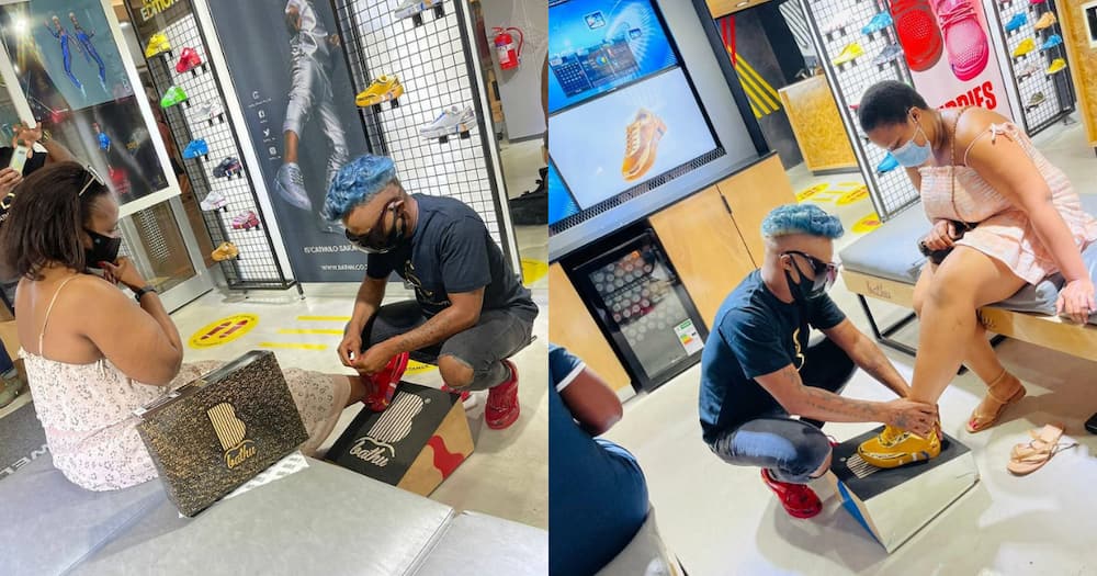Somizi humbles himself to help customers try on his new shoes