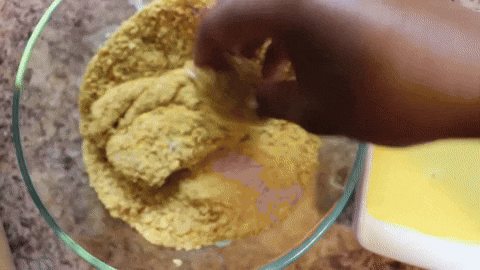 Coating chicken tenders with cornflakes mixture