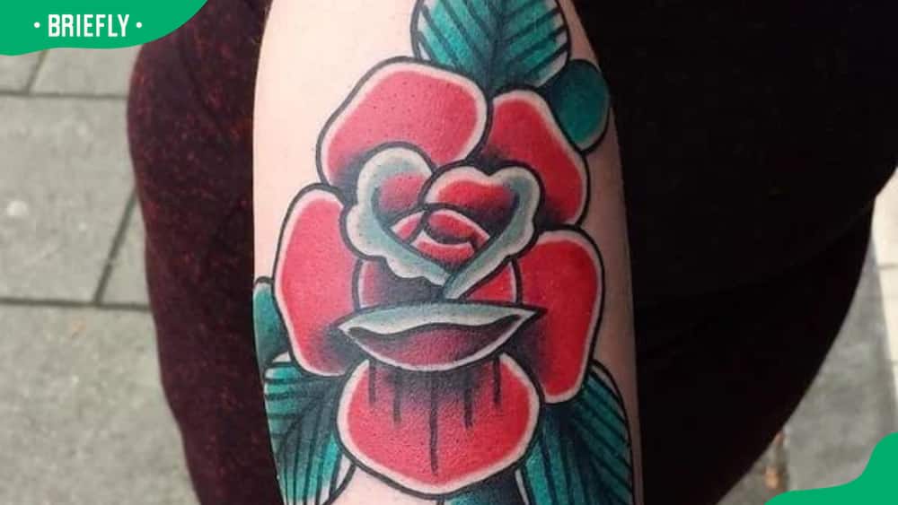 Arty cartoon rose tattoo