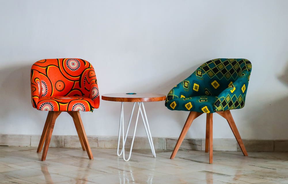 Two assorted colour padded chairs