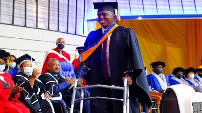 Robbery shooting survivor graduates with degree 14 years after the incident that left him partially paralysed