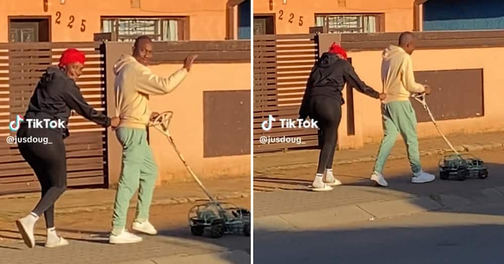 Video of kasi couple pushing a wire car in the street