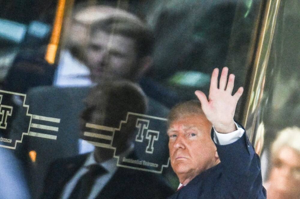 Donald Trump arrives in New York where he will surrender to unprecedented criminal charges for an ex-president