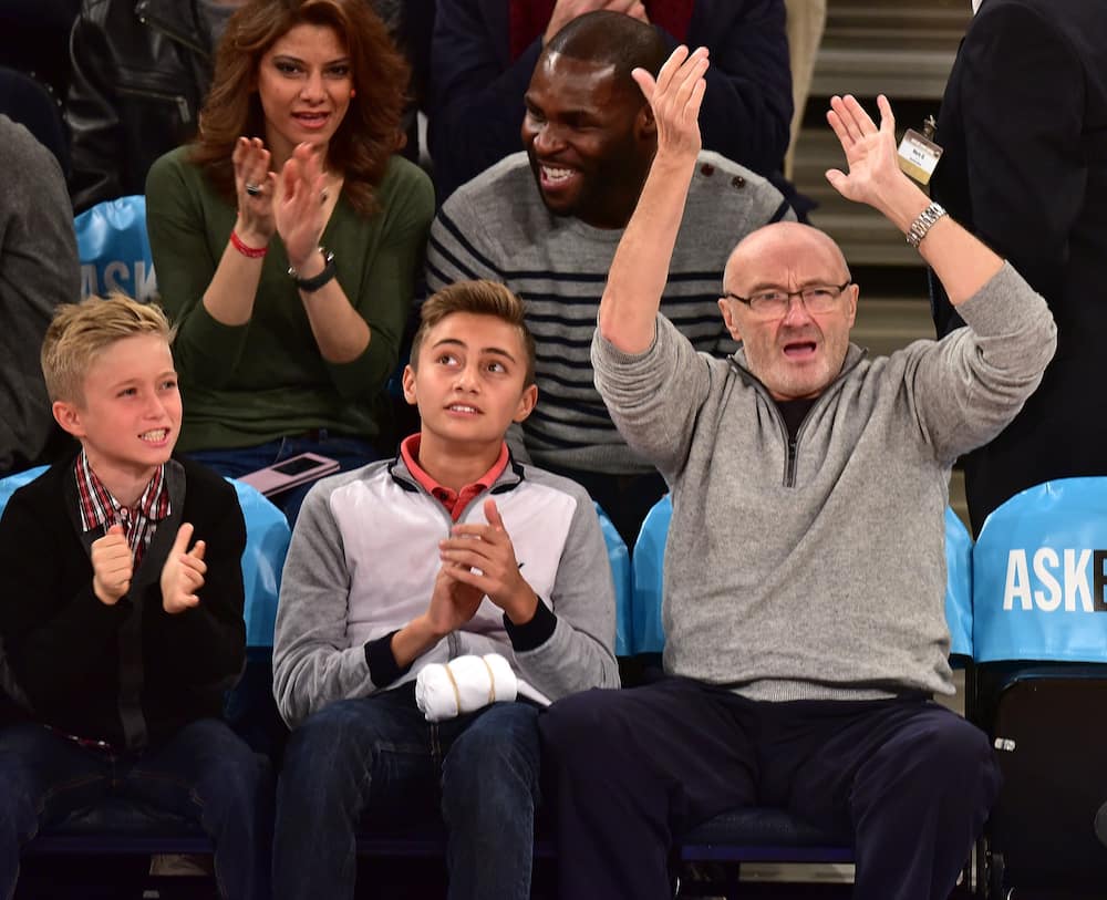 Drummer Phil Collins and his sons Matthew and Nicholas attend the Detroit Pistons vs New York Knicks game at Madison Square Garden on 2 January 2015.
