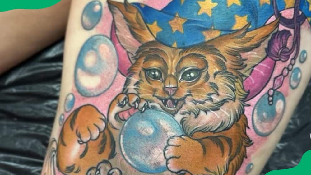 Mystical crystal ball cat tattoo