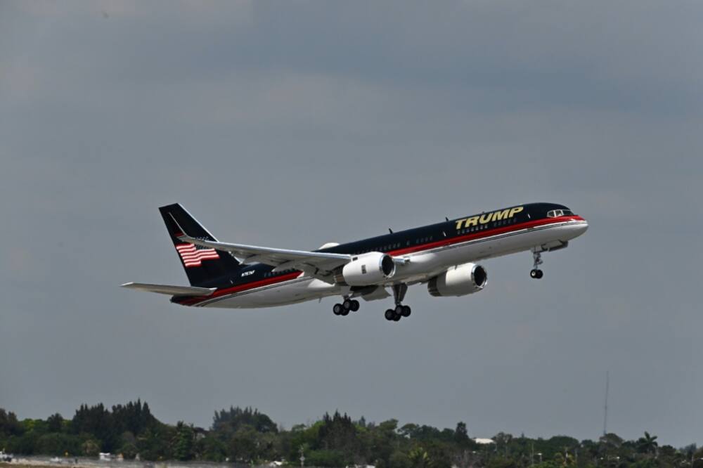 The plane of former US president Donald Trump takes off from Palm Beach International Airport in West Palm Beach, Florida