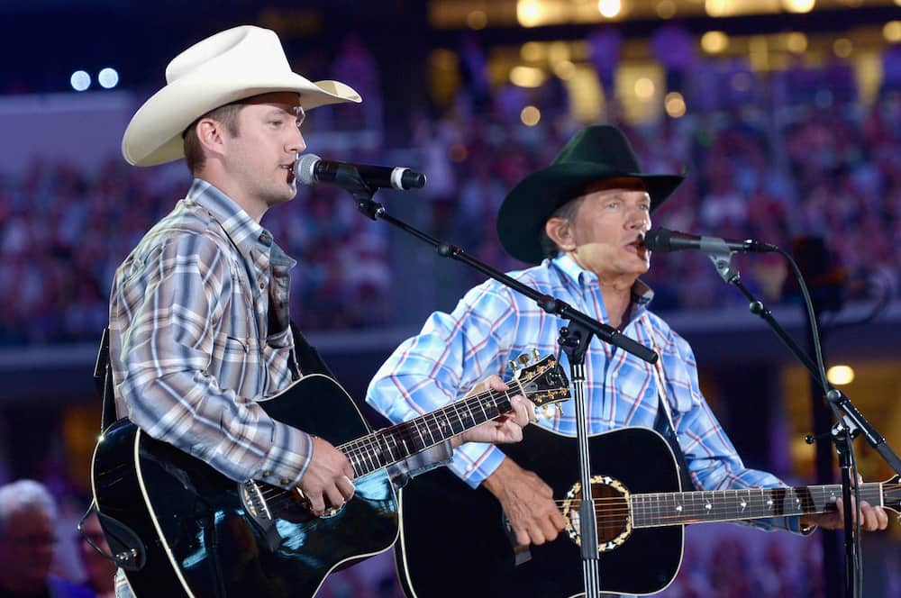 Country singer George with son Bubba perform onstage at George Strait's The Cowboy Rides Away Tour final stop at AT&T Stadium on 7th June 2014.