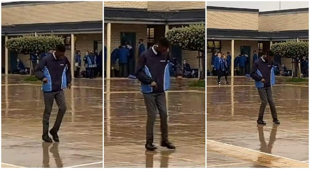 Young black boy dances on a wet floor