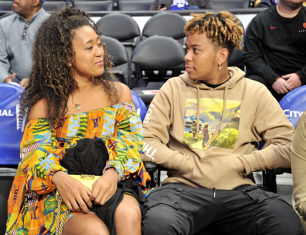 Cordae Dunston, left, and Naomi Osaka attend The Metropolitan