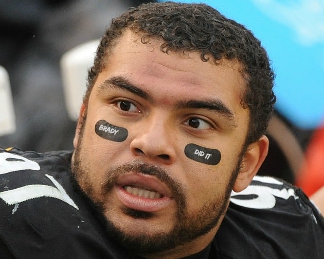 why do football players put black under their eyes?