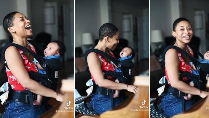 Gorgeous lady playing piano with baby in arms in a heartwarming video has viewers smitten and adoring