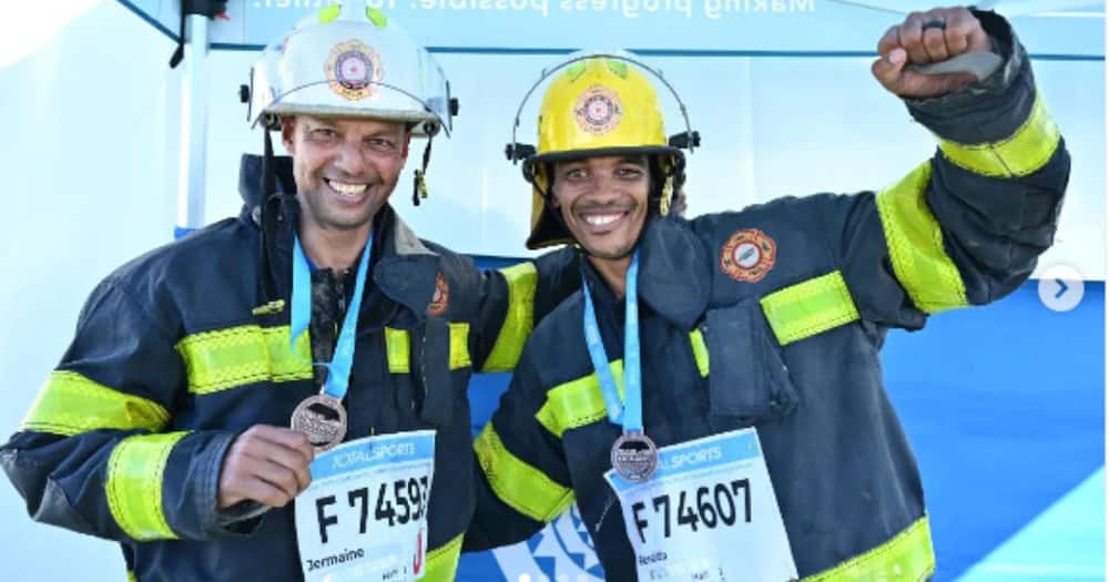 Jermaine Carelse and Renaldo Duncan ran the Two Oceans marathon in full firemen gear