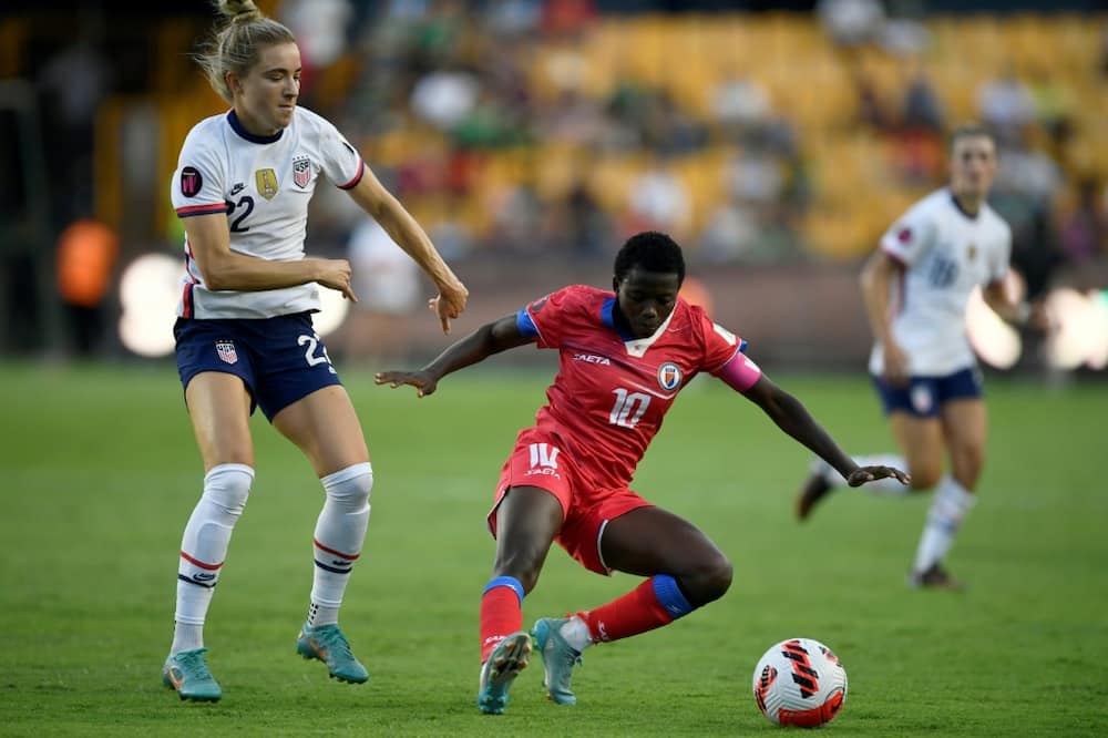 The United States' Kristie Mewis (L) vies for the ball with Haiti's Nerilia Mondesir during the CONCACAF W tournament in Monterrey, Mexico