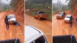 Toyota Hilux bakkie loses control on muddy road, almost knocks 2 people: Clip has SA dishing driving advice