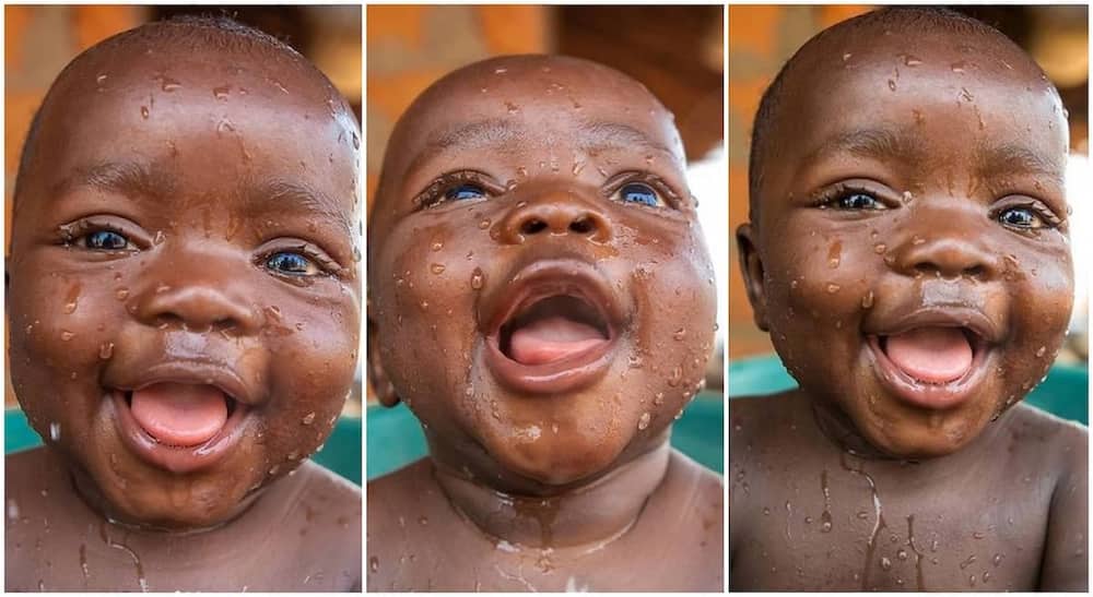 Cute black baby boy smiling.