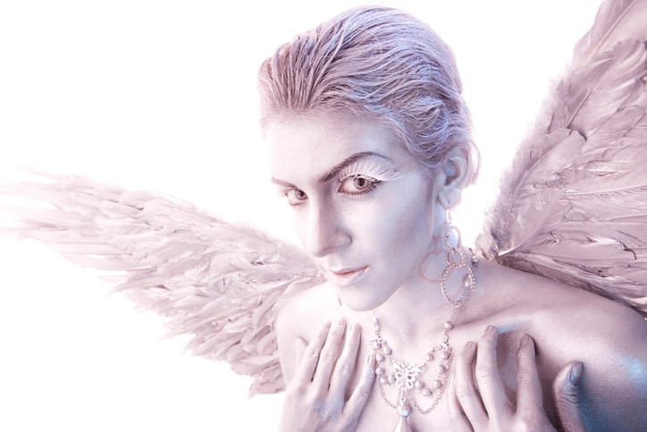 A woman's body painted in silver as a heavenly angel