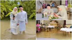 Through rain or shine: Young couple doesn't allow heavy flood to stop them from getting married