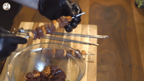 Placing liver pieces on skewers