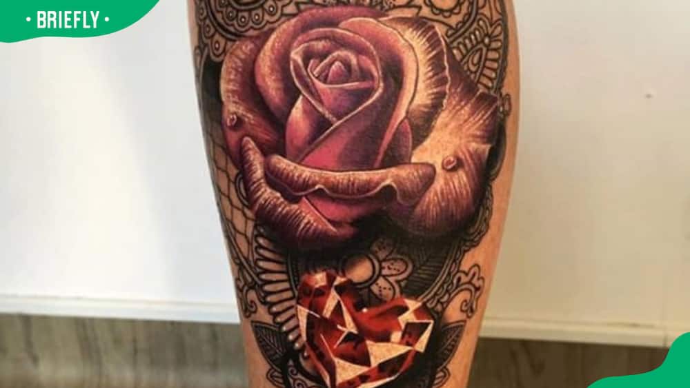 Intricate rose and ruby tattoo