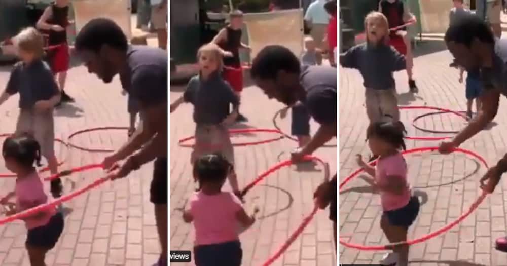 Father helps daughter hula-hoop in cute clip