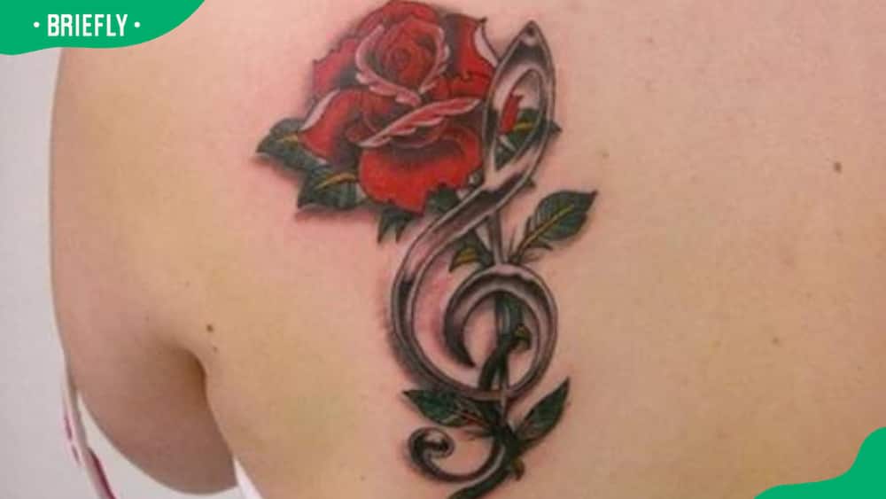 Treble clef rose tattoo
