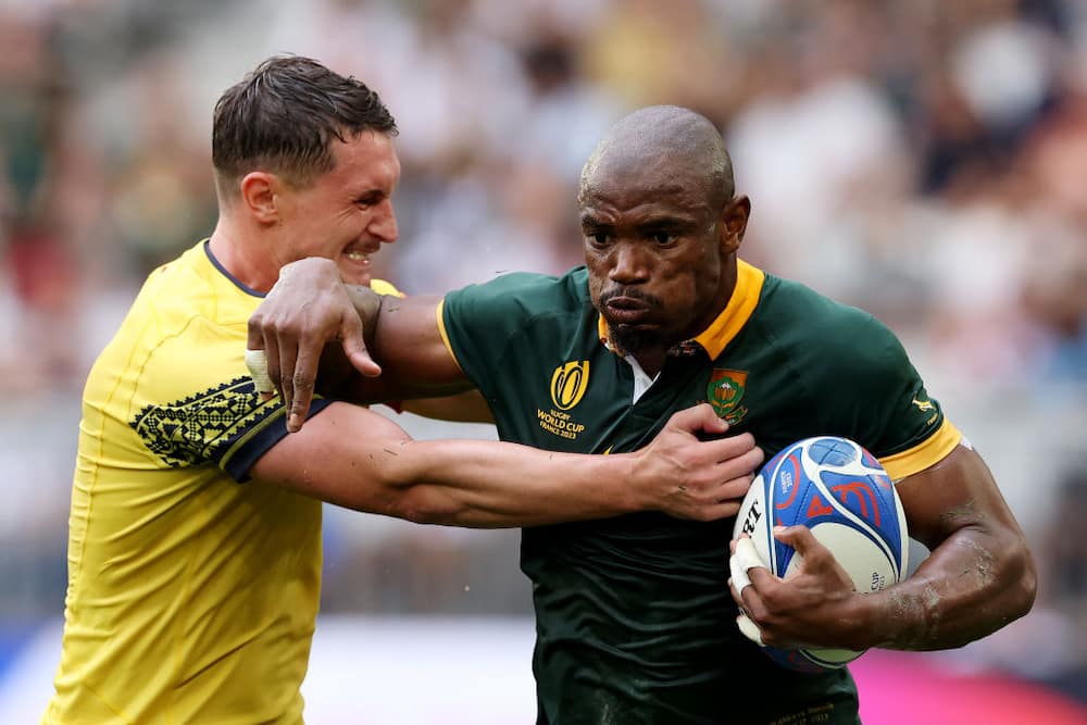 Makazole Mapimpi of South Africa is tackled by Gabriel Rupanu of Romania during the Rugby World Cup France 2023 match between South Africa and Romania