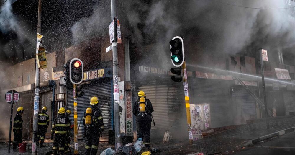 Picture of Firefighters putting out a fire in Johannesburg CBD