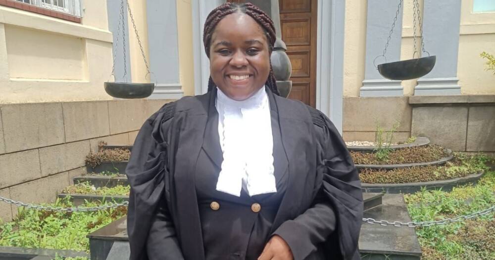A young lady smiles broadly after becoming a legal practitioner