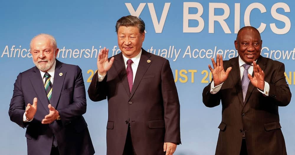 President of Brazil Luiz Inacio Lula da Silva, President of China Xi Jinping and South African President Cyril Ramaphosa gesture during the 2023 BRICS Summit