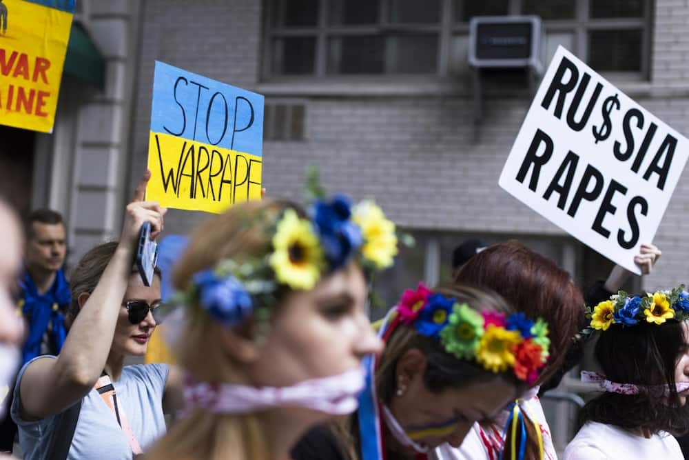 Activists accuse Russian troops of rape during the war in Ukraine at a protest in front of the Russian consulate in New York in May