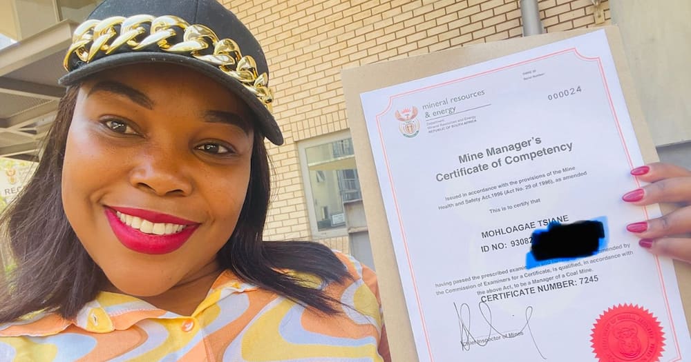The Pretoria woman in mining holding her certificate proudly