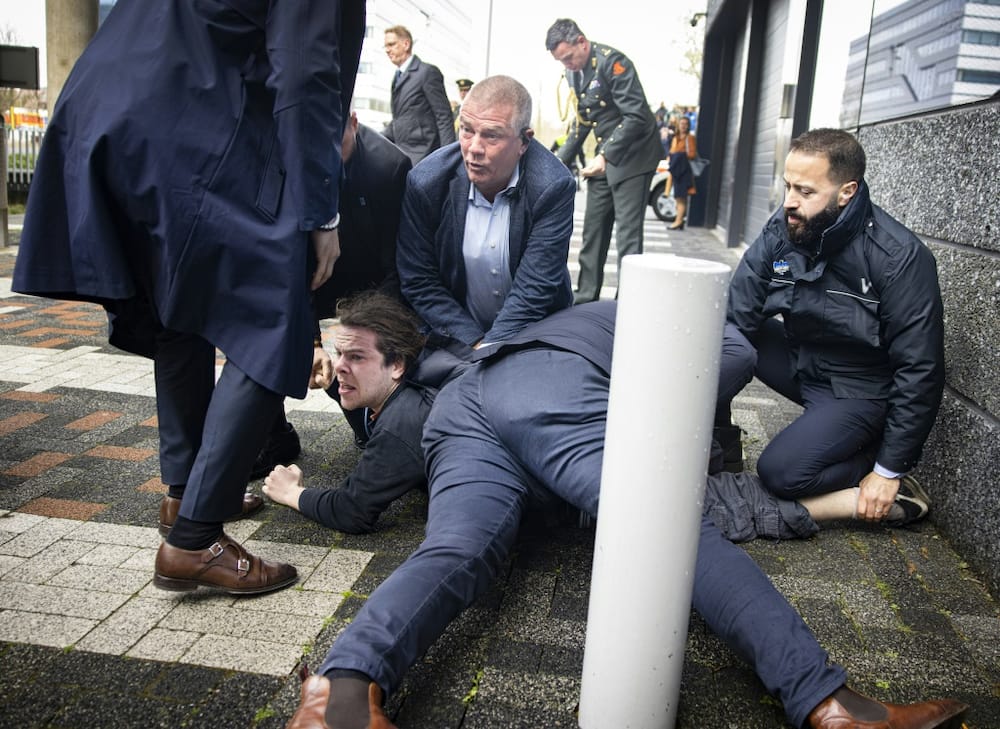 Dutch police said two protesters were arrested as French President Emmanuel Macron visited Amsterdam University